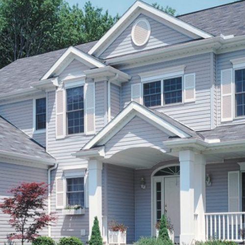 a big house with white siding in Chicago